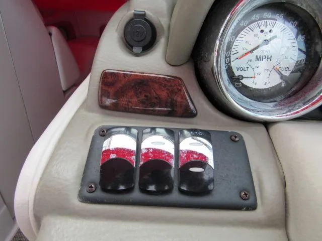 Slide: The Image of Dashboard controls and speedometer of a 2016 Crownline 255 SS boat. - 30