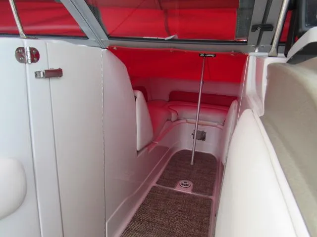 Slide: The Image of Interior cabin of 2016 Crownline 255 SS boat with red canopy. - 31
