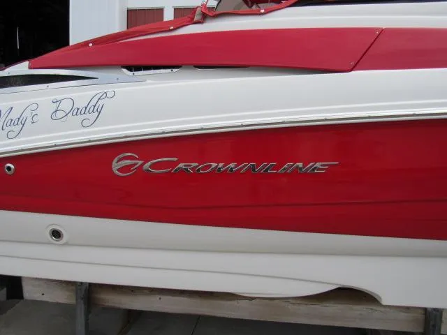 Slide: The Image of 2016 Crownline 255 SS boat with red and white exterior. - 4