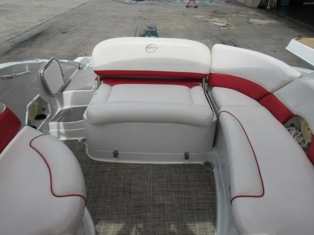 Slide: The Image of 2016 Crownline 255 SS boat interior with white and red seating. - 7