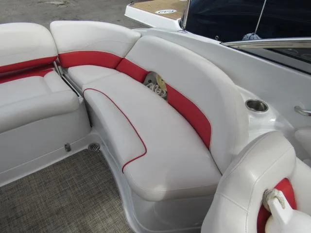 Slide: The Image of 2016 Crownline 255 SS boat interior with white and red seating. - 9