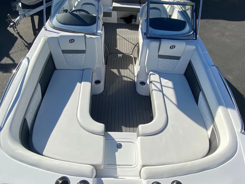 Slide: The Image of 2022 Hurricane SD217OB boat interior with white seating and dual consoles. - 4