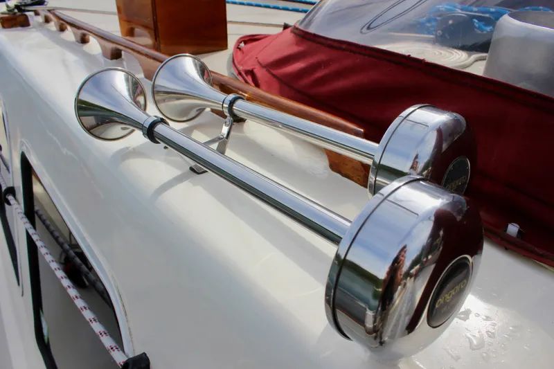 Slide: The Image of Chrome boat horns on a 1981 Skookum 53 yacht deck. - 32