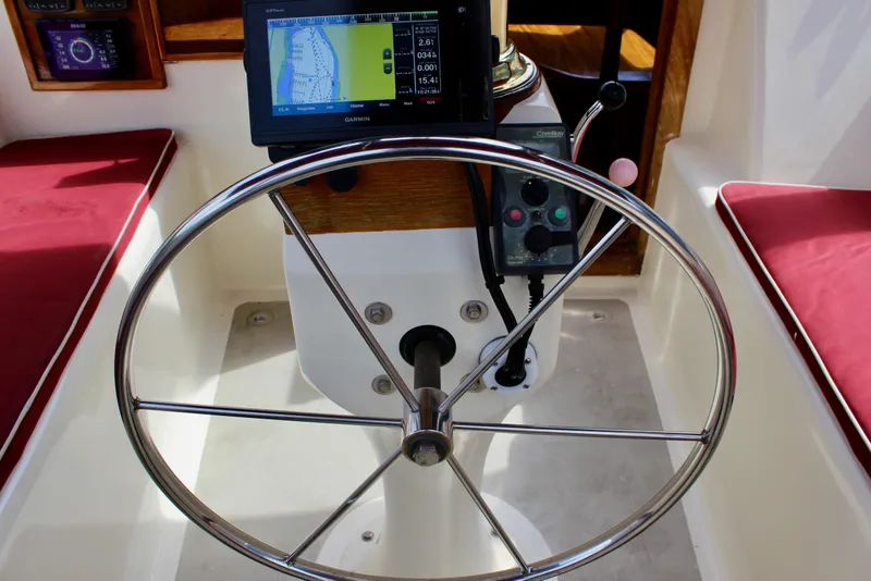 Slide: The Image of Steering wheel and navigation system on 1981 Skookum 53 boat. - 38