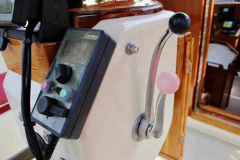 Slide: The Image of Control panel and throttle lever on a 1981 Skookum 53 boat. - 39