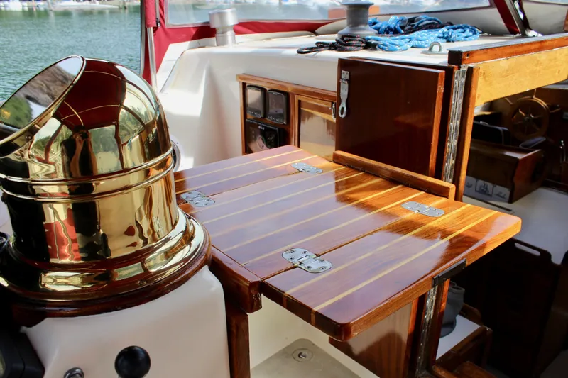 Slide: The Image of 1981 Skookum 53 yacht interior with polished wood and brass details. - 47