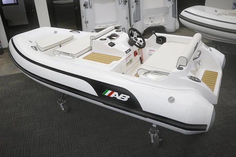 The Image of 2023 AB Inflatables JET 330 boat on display indoors. - 4