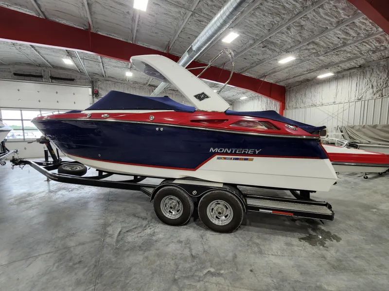 The Image of 2015 Monterey 268 Super Sport BR boat on trailer in indoor storage. - 0