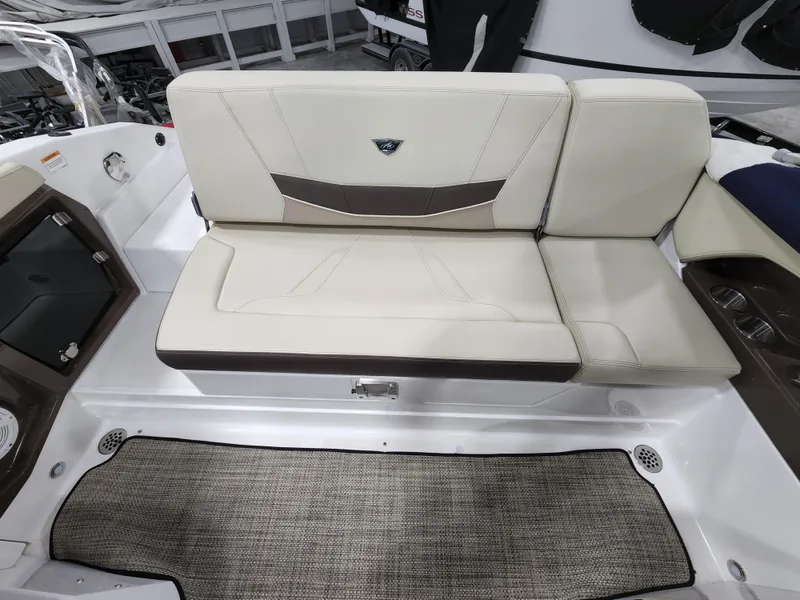 Slide: The Image of 2015 Monterey 268 Super Sport BR boat interior seating area with beige upholstery. - 10