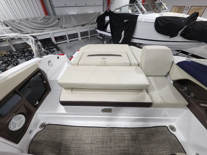 Slide: The Image of 2015 Monterey 268 Super Sport BR boat interior with white leather seating. - 11