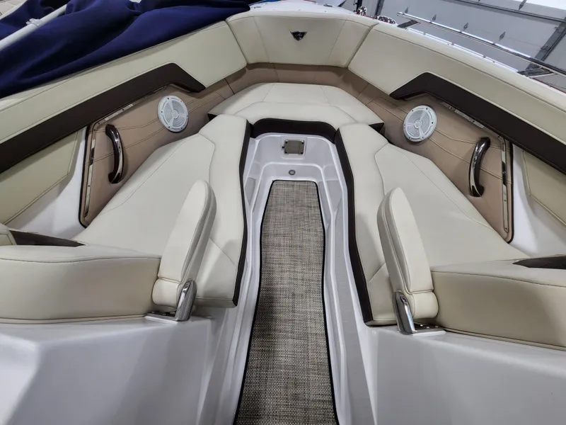 Slide: The Image of 2015 Monterey 268 Super Sport BR boat interior with beige seating and speakers. - 12