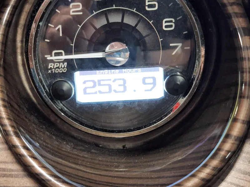 Slide: The Image of Close-up of 2015 Monterey 268 Super Sport BR engine hour meter displaying 233.9 hours. - 16