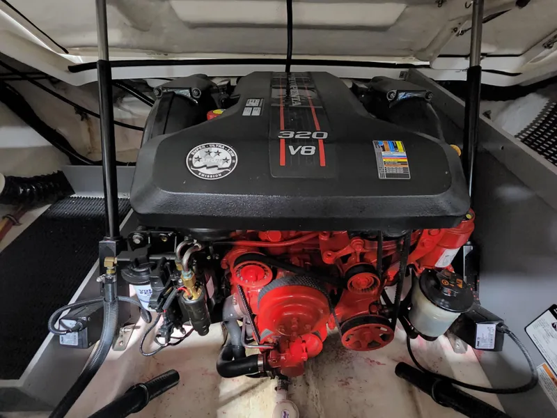 Slide: The Image of 2015 Monterey 268 Super Sport BR boat engine compartment with 320 V8 engine. - 17