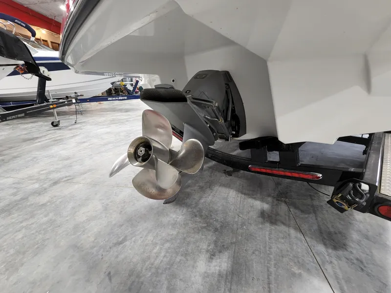 Slide: The Image of 2015 Monterey 268 Super Sport BR boat propeller and stern on trailer in garage. - 3