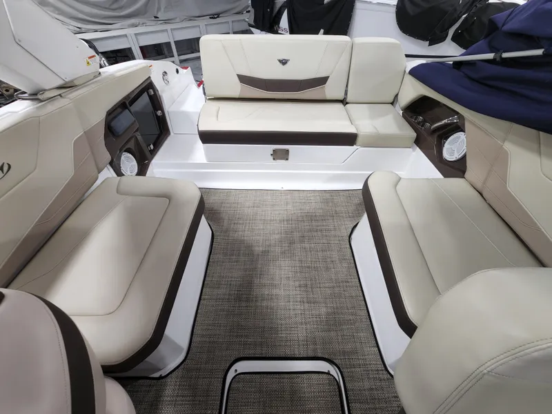Slide: The Image of 2015 Monterey 268 Super Sport BR boat interior with beige and brown seating. - 9