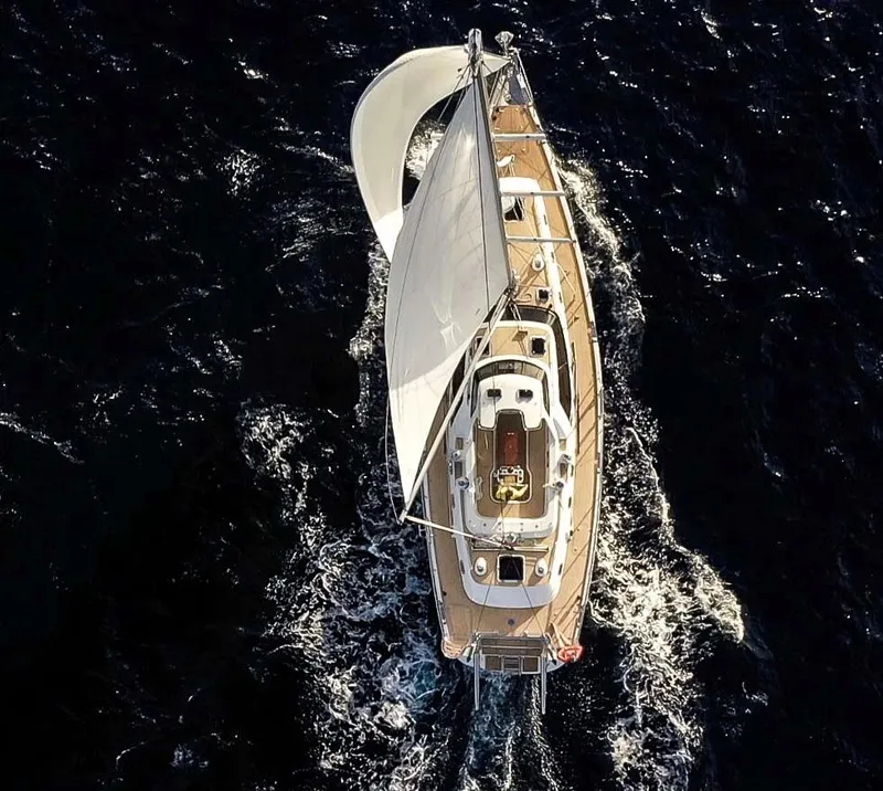 Slide: The Image of Aerial view of 2020 Bluewater 56 yacht sailing on deep blue ocean. - 11