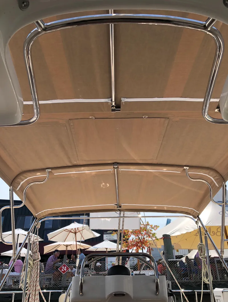 Slide: The Image of View from the helm of a 2020 Bluewater 56 yacht, showcasing the canopy and outdoor setting. - 21
