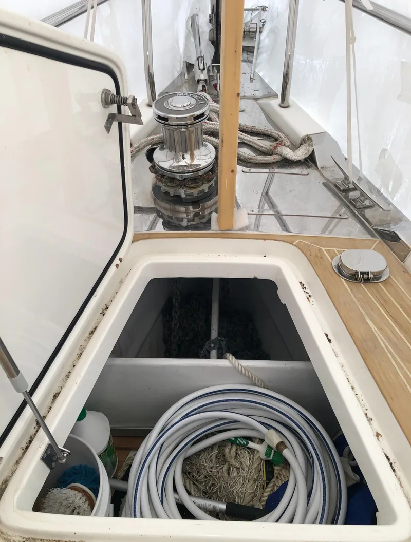Slide: The Image of Storage compartment on 2020 Bluewater 56 yacht deck with ropes and equipment. - 23
