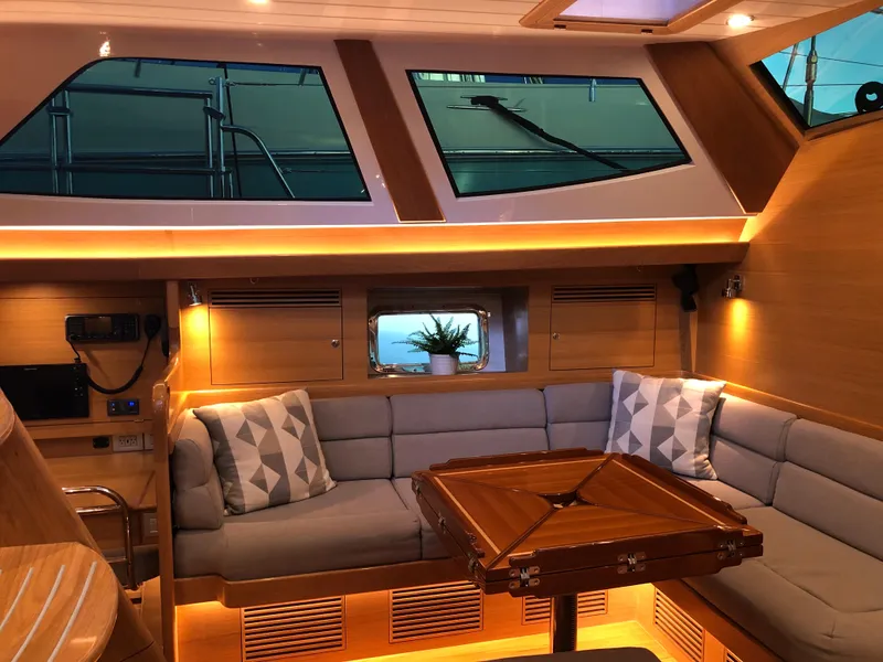 Slide: The Image of Luxurious interior of 2020 Bluewater 56 yacht with cozy seating and elegant lighting. - 28