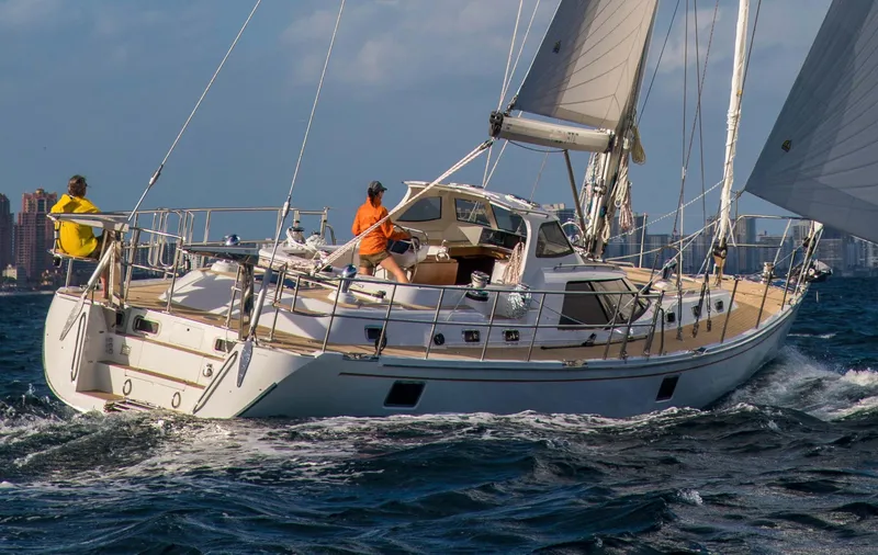 Slide: The Image of 2020 Bluewater 56 yacht sailing on open sea with crew onboard. - 3