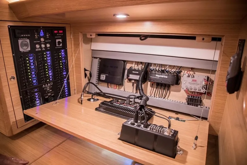 Slide: The Image of Electrical control panel inside a 2020 Bluewater 56 yacht, featuring advanced wiring and components. - 36