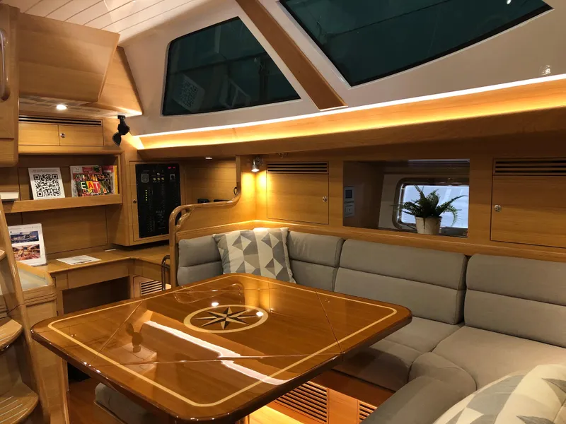 Slide: The Image of Luxurious interior of 2020 Bluewater 56 yacht with elegant wood finishes and plush seating. - 42