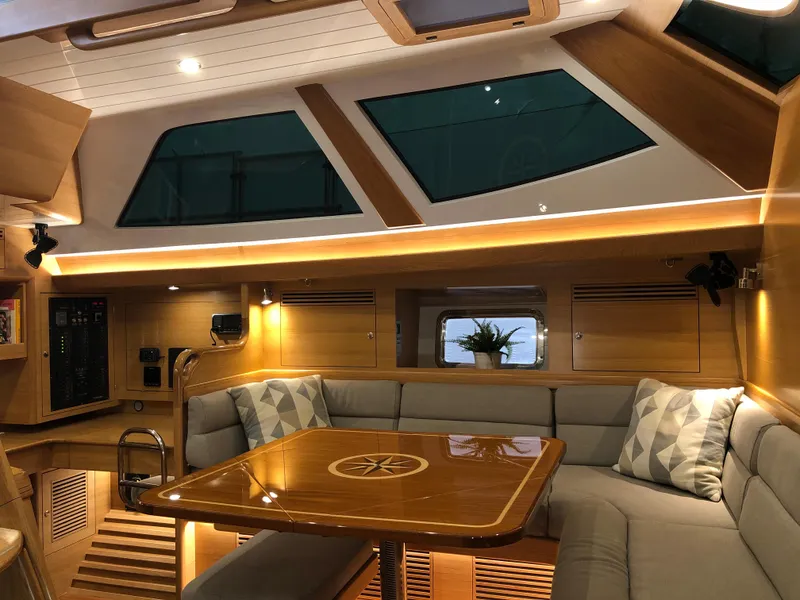 Slide: The Image of Luxurious interior of 2020 Bluewater 56 yacht with elegant wood finish and plush seating. - 43