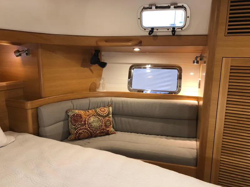 Slide: The Image of Luxurious interior of 2020 Bluewater 56 yacht with cozy seating and elegant wood finish. - 45