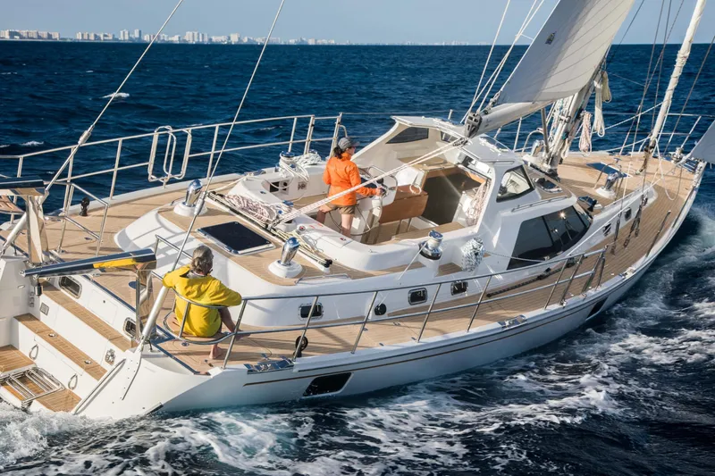 Slide: The Image of Sailing on a 2020 Bluewater 56 yacht in open sea, two people onboard. - 6