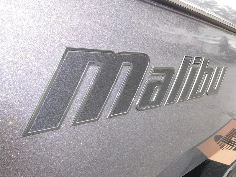 Slide: The Image of 2017 Malibu Wakesetter 24 MXZ logo on boat exterior. - 16