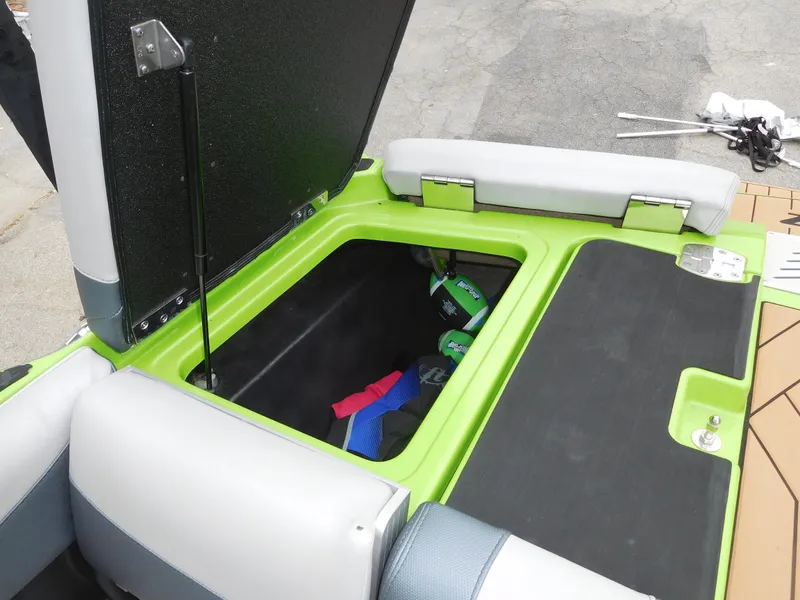 Slide: The Image of 2017 Malibu Wakesetter 24 MXZ storage compartment with open hatch. - 23