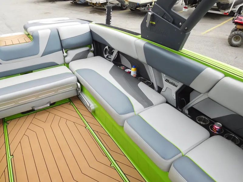 Slide: The Image of 2017 Malibu Wakesetter 24 MXZ interior with gray and green seating. - 27