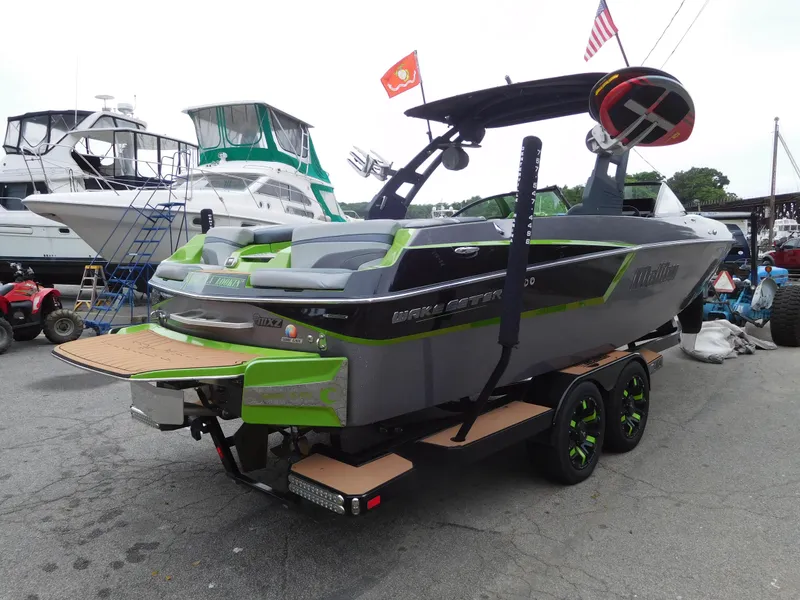 Slide: The Image of 2017 Malibu Wakesetter 24 MXZ boat on trailer at marina. - 3