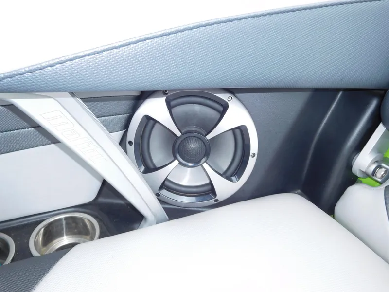 Slide: The Image of Close-up of speaker and cup holders in 2017 Malibu Wakesetter 24 MXZ boat. - 30