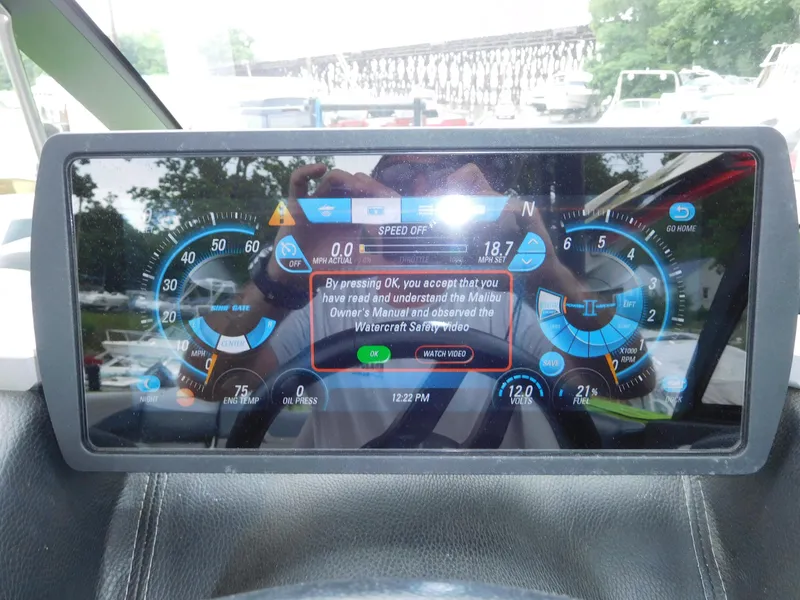 Slide: The Image of Dashboard display of a 2017 Malibu Wakesetter 24 MXZ boat showing various gauges and warnings. - 34
