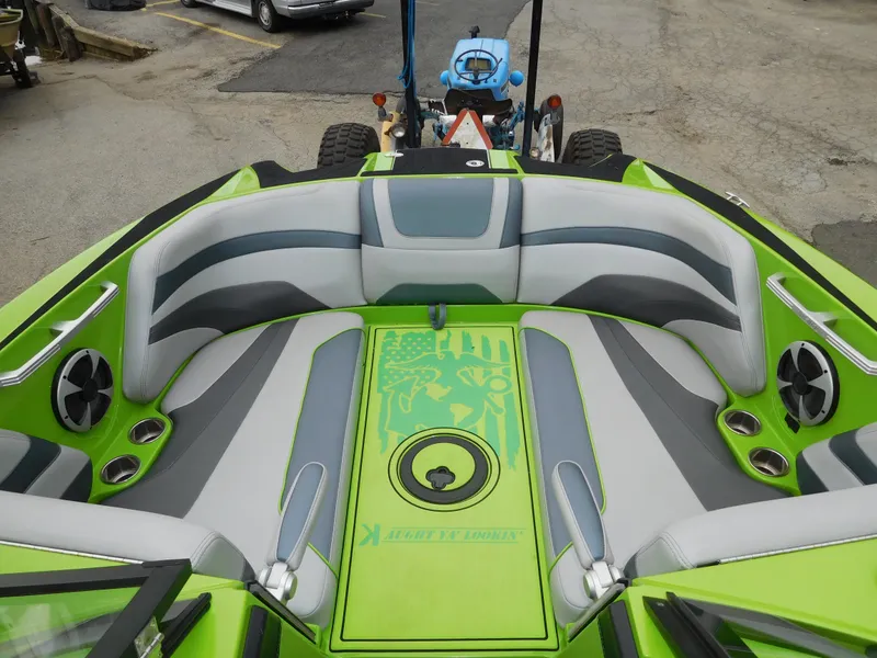 Slide: The Image of 2017 Malibu Wakesetter 24 MXZ boat with green and gray interior. - 38