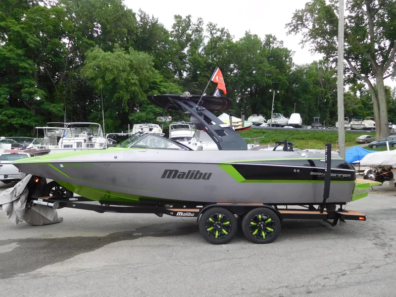 Slide: The Image of 2017 Malibu Wakesetter 24 MXZ boat on trailer at marina. - 4