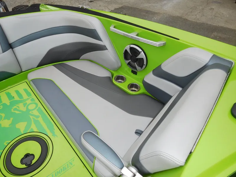 Slide: The Image of 2017 Malibu Wakesetter 24 MXZ interior with green and gray seating. - 41