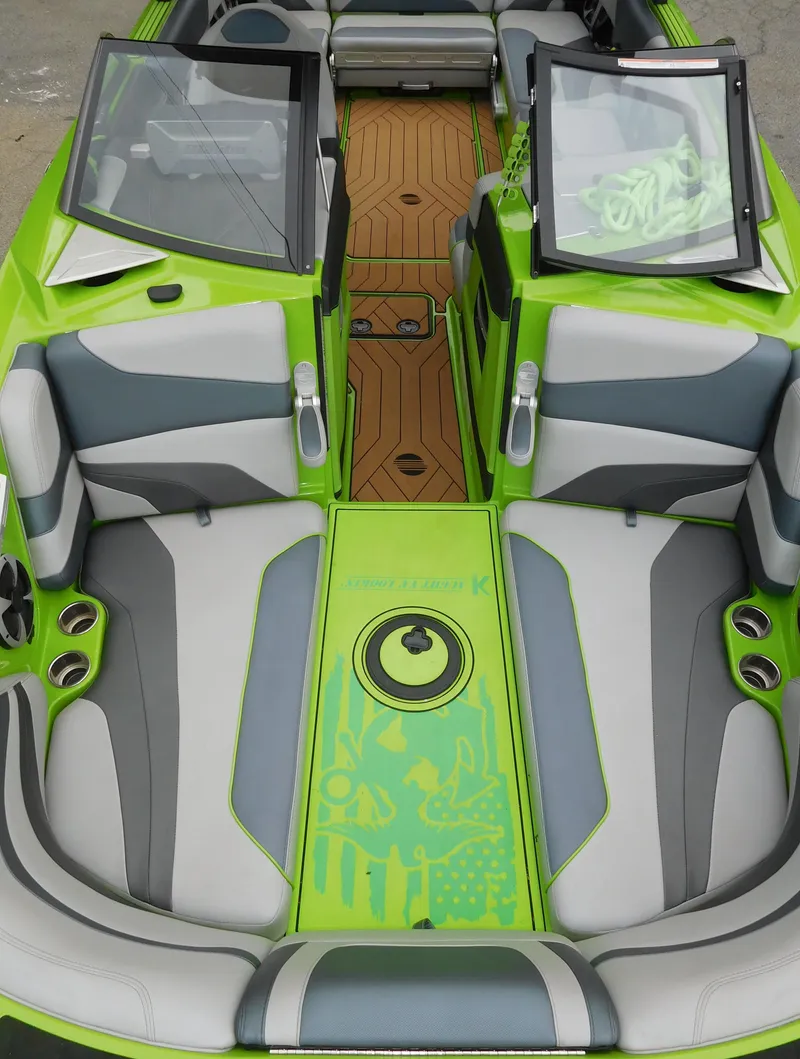 Slide: The Image of 2017 Malibu Wakesetter 24 MXZ interior with green and gray seating. - 42