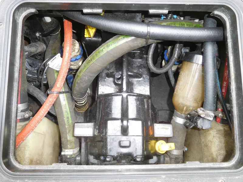 Slide: The Image of 2017 Malibu Wakesetter 24 MXZ engine compartment with hoses and components. - 46