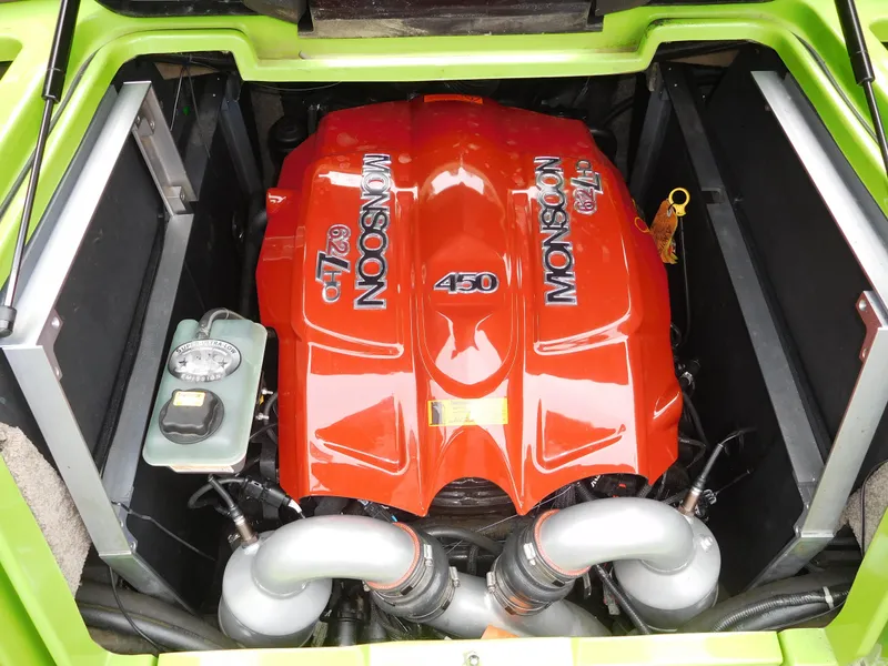 Slide: The Image of 2017 Malibu Wakesetter 24 MXZ Monsoon 450 engine in green boat. - 47