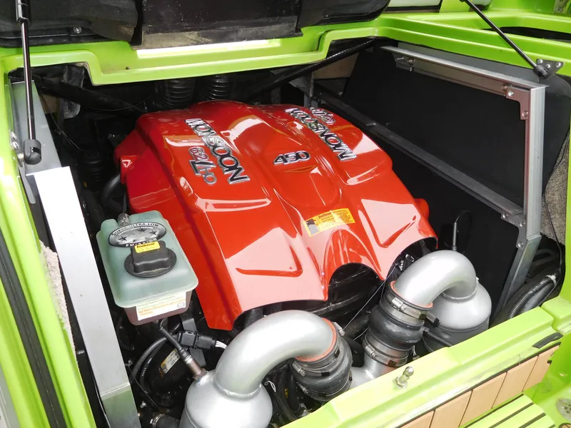 Slide: The Image of 2017 Malibu Wakesetter 24 MXZ engine compartment with red Monsoon engine. - 48