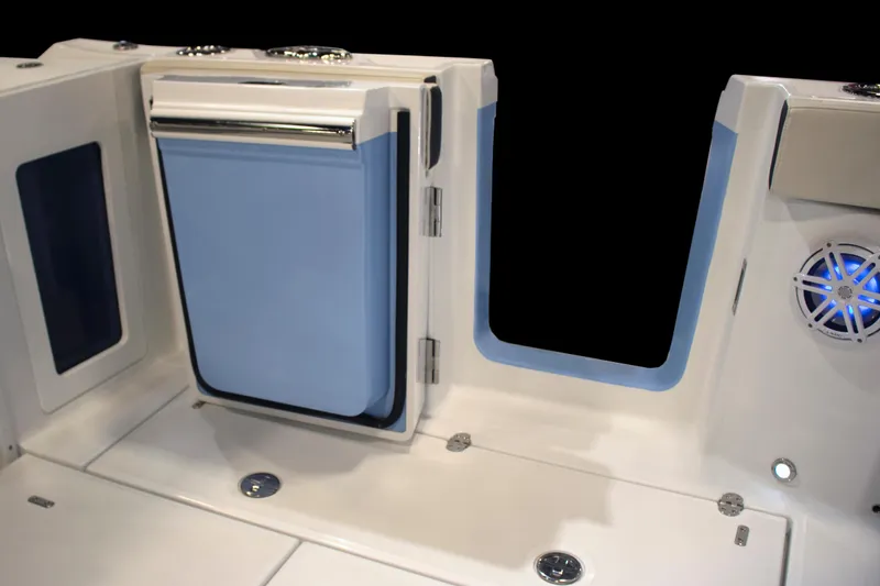 Slide: The Image of 2024 Blackfin 302 DC boat interior with storage compartment and speaker. - 7