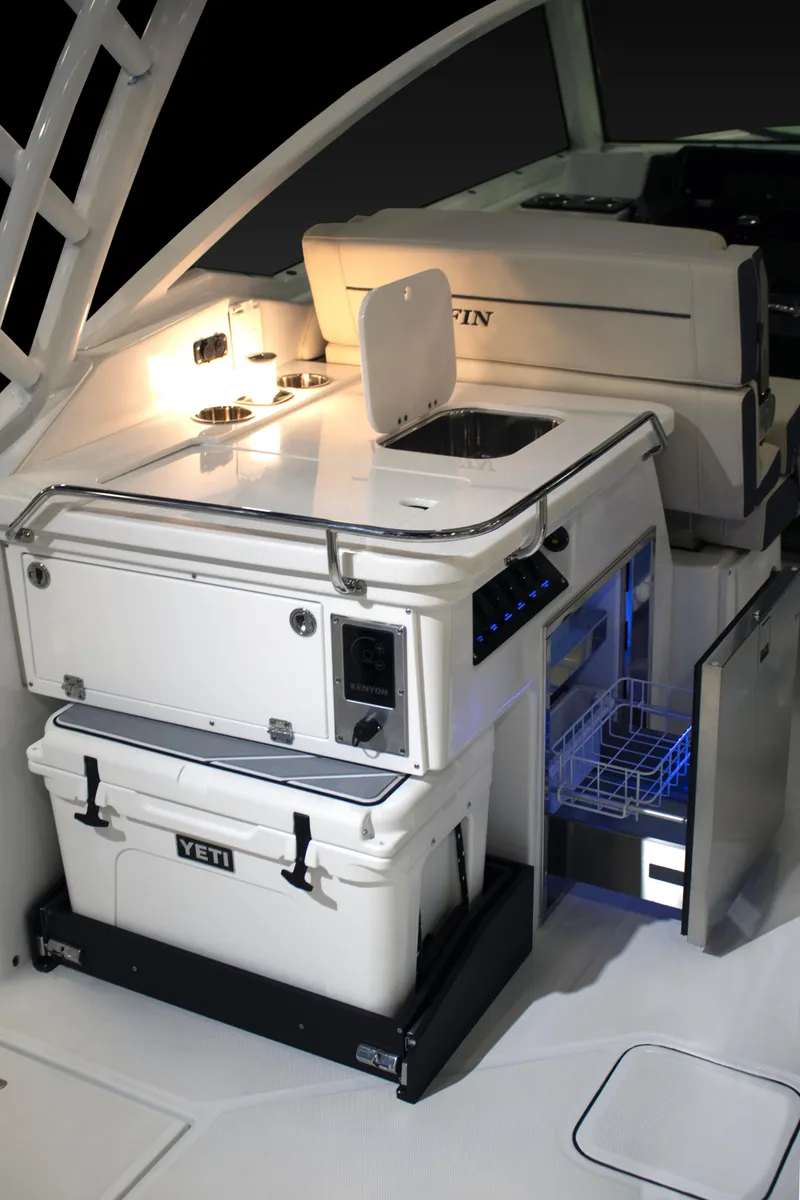 Slide: The Image of 2024 Blackfin 302 DC boat interior with kitchen amenities and Yeti cooler. - 9