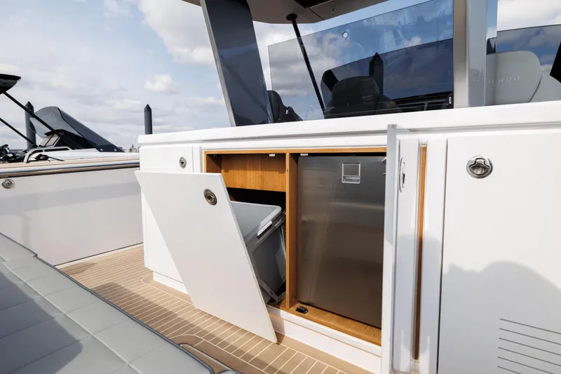 Slide: The Image of Pardo Yachts 43 (2024) open storage compartment and mini fridge on deck. - 20