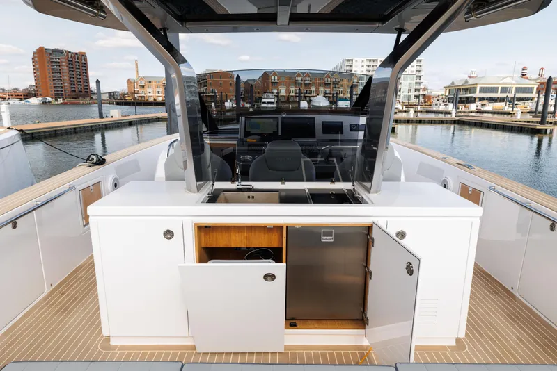 Slide: The Image of Pardo Yachts 43 (2024) interior with open cabinets, docked at a marina. - 22