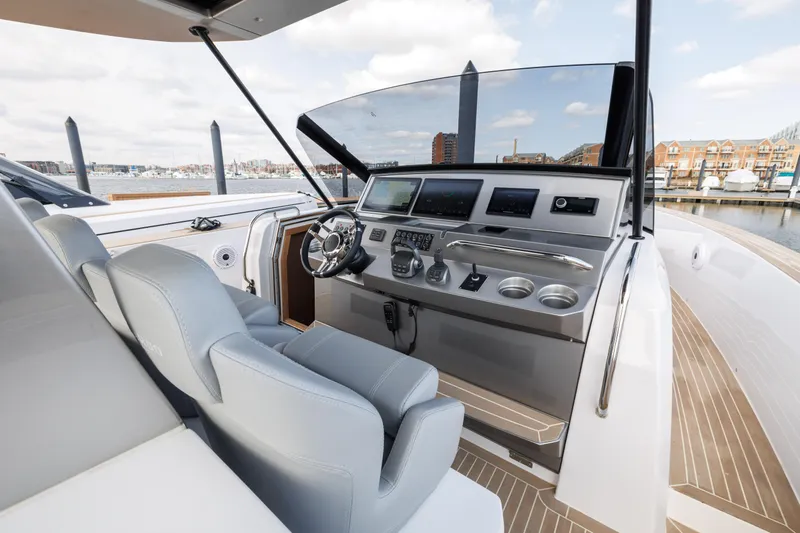 Slide: The Image of 2024 Pardo Yachts 43 helm station with modern controls and luxurious seating. - 23