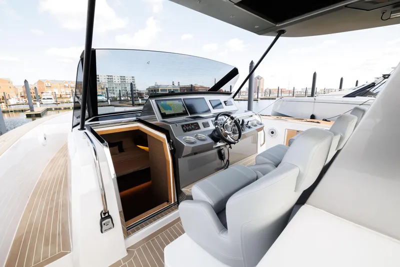 Slide: The Image of 2024 Pardo Yachts 43 cockpit with modern navigation system and luxurious seating. - 25