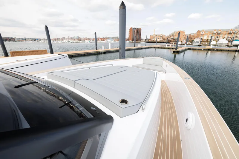 Slide: The Image of 2024 Pardo Yachts 43 docked, showcasing sleek deck design and waterfront view. - 31