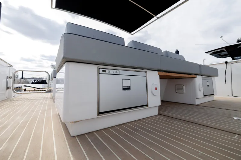 Slide: The Image of 2024 Pardo Yachts 43 deck with built-in storage and cushioned seating. - 39